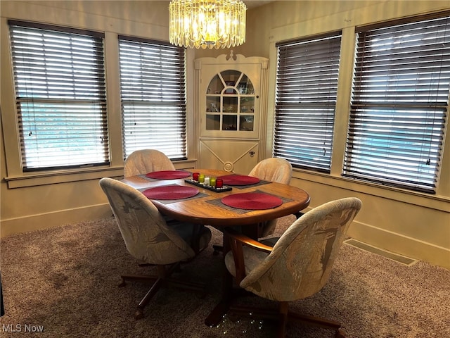 1275 Hollywood, Warren, OH 44483 - carpeted dining area with a chandelier and baseboards