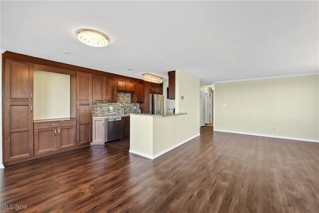 12520 Edgewater Dr Unit 905, Lakewood, OH 44107 - kitchen with tasteful backsplash, dark wood-type flooring, baseboards, a peninsula, and appliances with stainless steel finishes