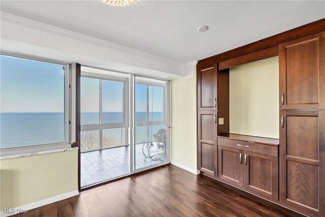 12520 Edgewater Dr Unit 905, Lakewood, OH 44107 - interior space with baseboards, crown molding, a water view, and dark wood-type flooring