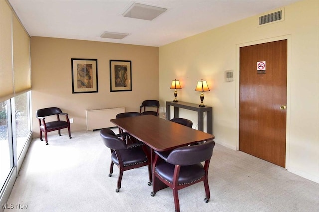 12520 Edgewater Dr Unit 905, Lakewood, OH 44107 - dining area featuring baseboards, visible vents, and light colored carpet