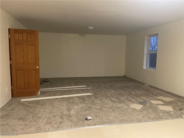 spare room featuring carpet