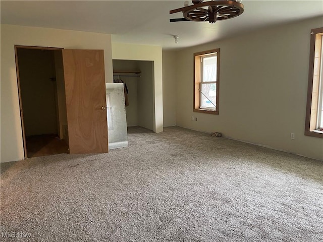 unfurnished bedroom with a closet and carpet