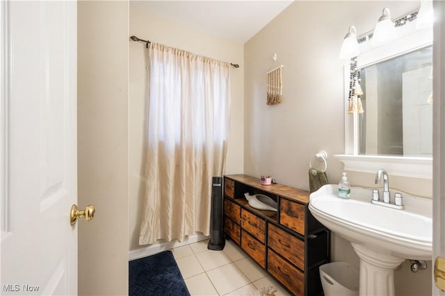 70 Iroquois Trl, Malvern, OH 44644 - bathroom featuring tile patterned flooring and a sink
