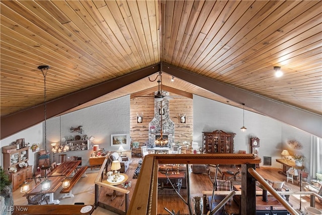 interior space featuring wood ceiling, lofted ceiling, and wood finished floors