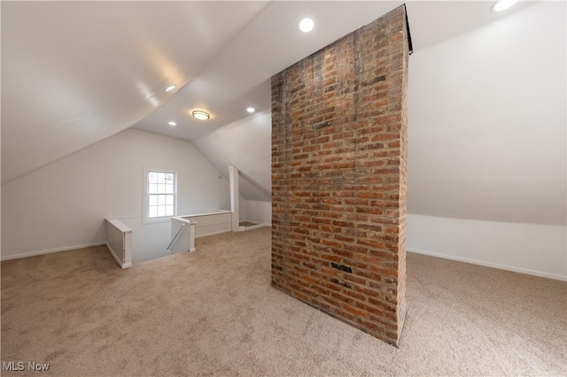 additional living space featuring carpet floors, vaulted ceiling, and recessed lighting