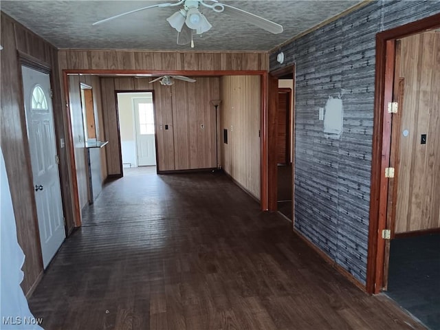 hall featuring dark wood-style floors and a textured ceiling