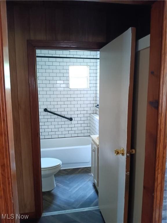 full bath featuring toilet, a shower, vanity, and a bathing tub