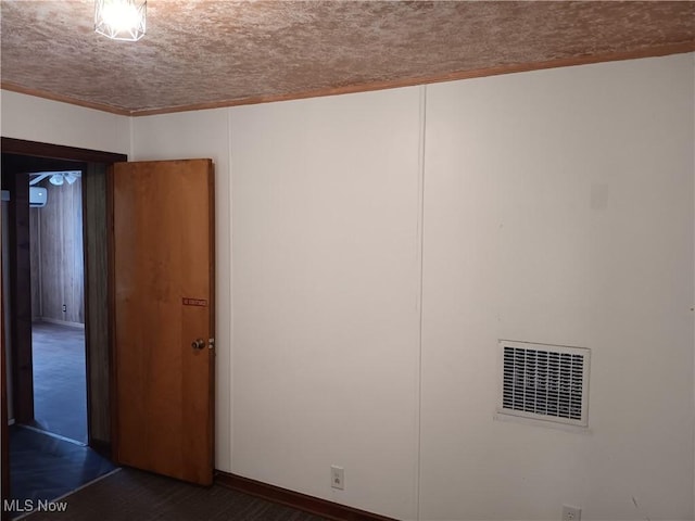 unfurnished room featuring visible vents