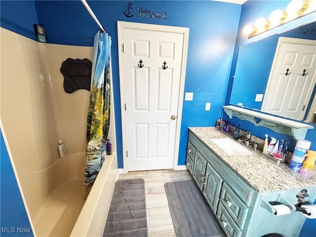 380 Sunshine Park Rd, Steubenville, OH 43952 - full bath featuring baseboards, wood finished floors, shower / tub combo, and vanity