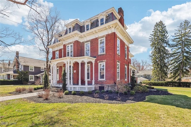 500 S Main St, Poland, OH 44514 - view of front of house with covered porch, brick siding, a front yard, and mansard roof