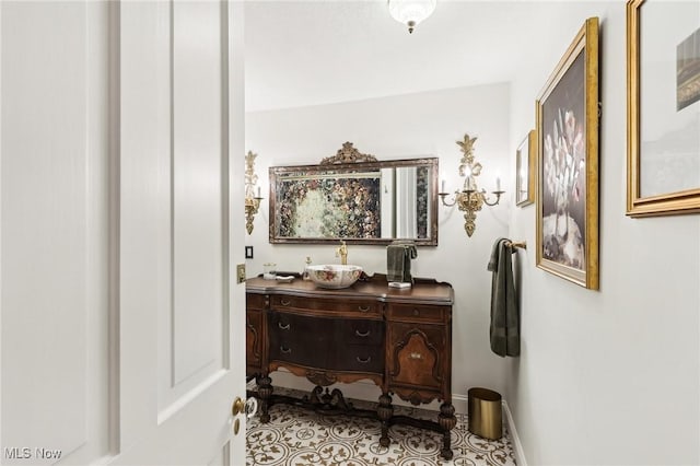 500 S Main St, Poland, OH 44514 - hall featuring baseboards, a sink, and tile patterned floors