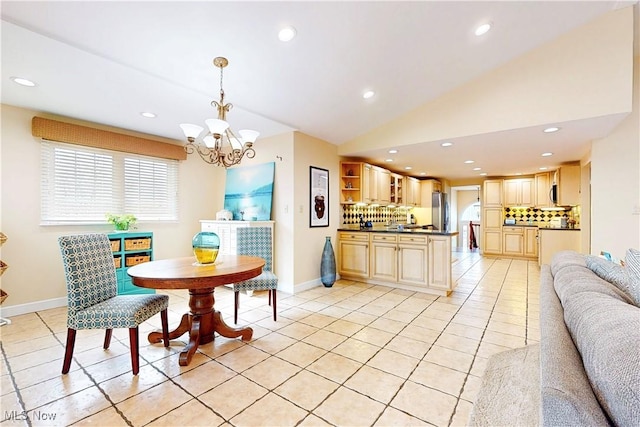 dining space featuring vaulted ceiling, recessed lighting, an inviting chandelier, light tile patterned floors, and baseboards