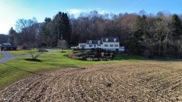 26949 County Road 25, Warsaw, OH 43844 - exterior space featuring a front yard and a wooded view