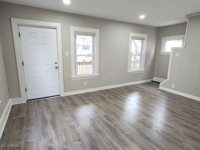 entrance foyer featuring recessed lighting, baseboards, ornamental molding, and wood finished floors