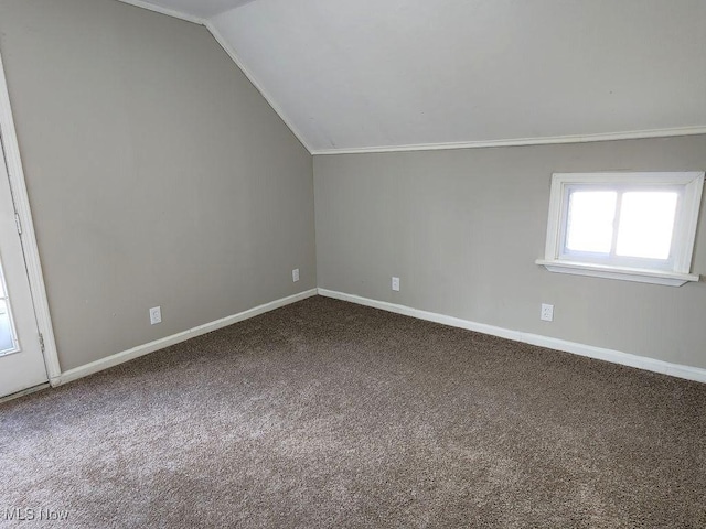 bonus room featuring carpet flooring, baseboards, and lofted ceiling