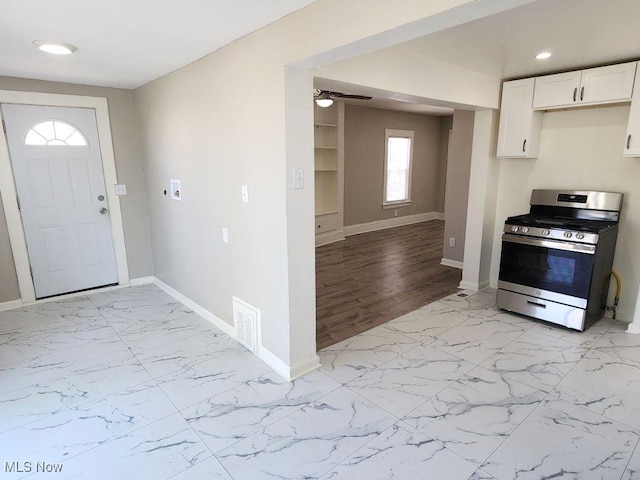 entryway with a ceiling fan, visible vents, recessed lighting, marble finish floor, and baseboards