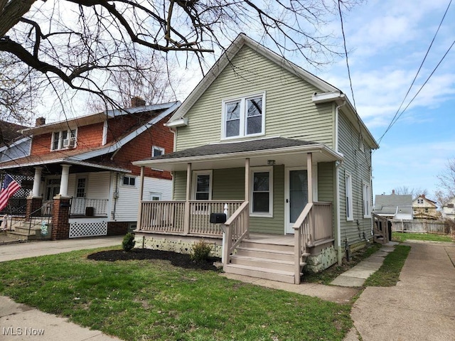 view of front of house featuring a porch and a chimney