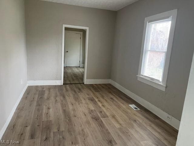 1900 Lamoille Ct, Cleveland, OH 44113 - spare room featuring wood finished floors and baseboards