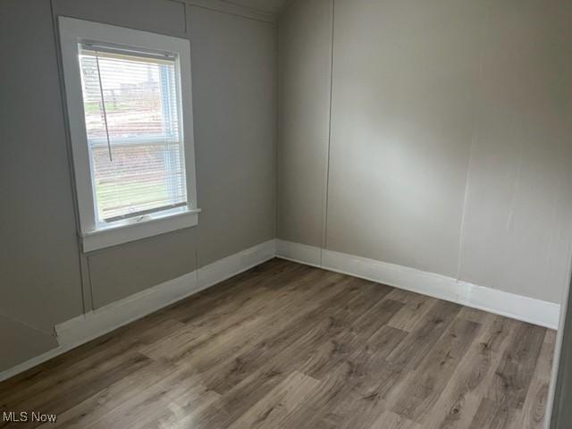 1900 Lamoille Ct, Cleveland, OH 44113 - spare room featuring wood finished floors and baseboards