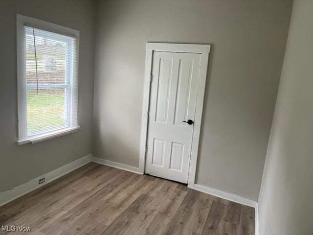 1900 Lamoille Ct, Cleveland, OH 44113 - spare room featuring wood finished floors and baseboards