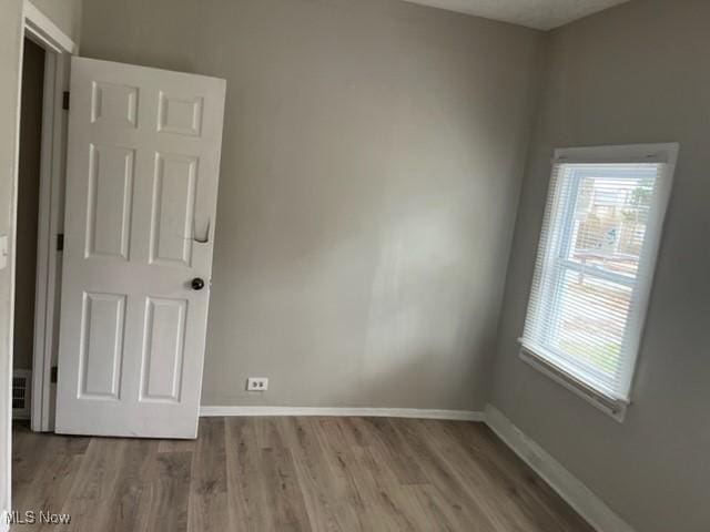 1900 Lamoille Ct, Cleveland, OH 44113 - spare room with wood finished floors and baseboards