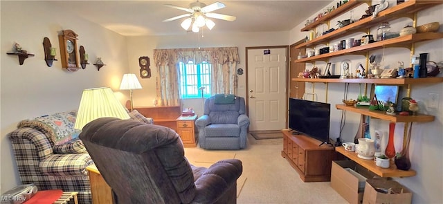 living room featuring a ceiling fan and light colored carpet