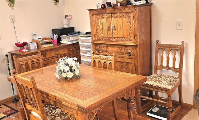 dining space featuring baseboards