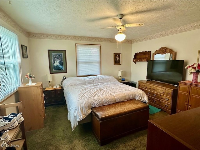 bedroom with a textured ceiling, a ceiling fan, and carpet floors