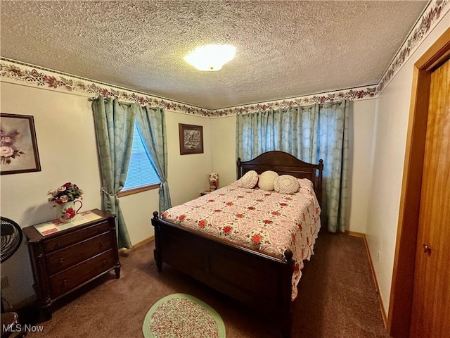 bedroom featuring carpet floors and a textured ceiling