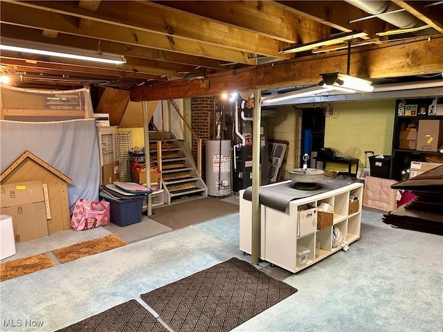 unfinished below grade area with stairway, heating unit, and water heater