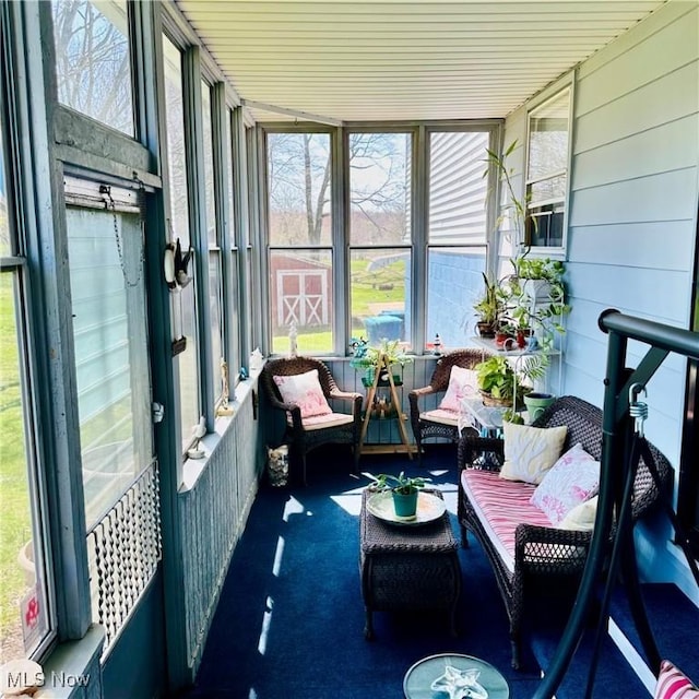 sunroom / solarium featuring a healthy amount of sunlight