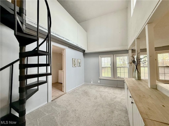 831 Fairview Ave, Parkersburg, WV 26101 - interior space featuring a towering ceiling, light carpet, and baseboards