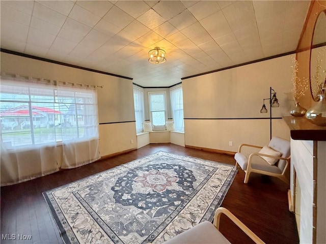 831 Fairview Ave, Parkersburg, WV 26101 - sitting room featuring baseboards, ornamental molding, and wood finished floors