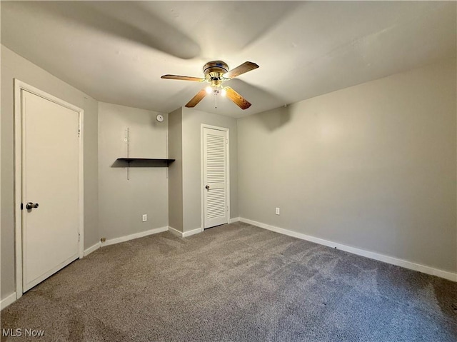 831 Fairview Ave, Parkersburg, WV 26101 - unfurnished bedroom featuring baseboards, ceiling fan, and dark carpet
