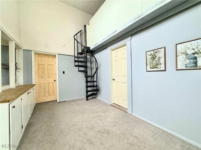 831 Fairview Ave, Parkersburg, WV 26101 - below grade area with stairs, baseboards, and carpet flooring