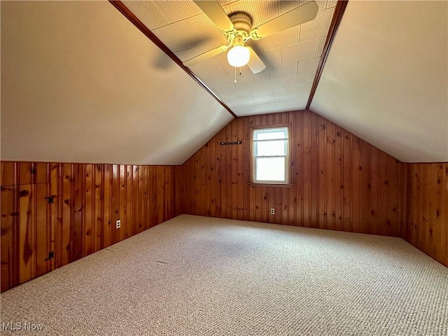 1563 Maplewood St NE, Warren, OH 44483 - additional living space featuring lofted ceiling, ceiling fan, wood walls, and carpet