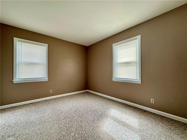 1563 Maplewood St NE, Warren, OH 44483 - spare room featuring baseboards