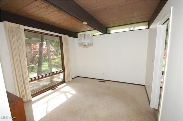 empty room featuring carpet, visible vents, wood ceiling, a chandelier, and beamed ceiling