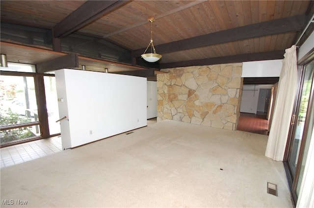 carpeted spare room featuring wooden ceiling, lofted ceiling with beams, and a healthy amount of sunlight
