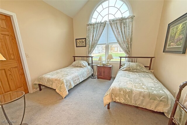 103 Southaven Ln, Kelleys Island, OH 43438 - carpeted bedroom featuring vaulted ceiling