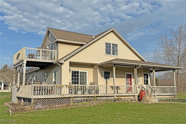 103 Southaven Ln, Kelleys Island, OH 43438 - back of property featuring a lawn, a shingled roof, and a porch