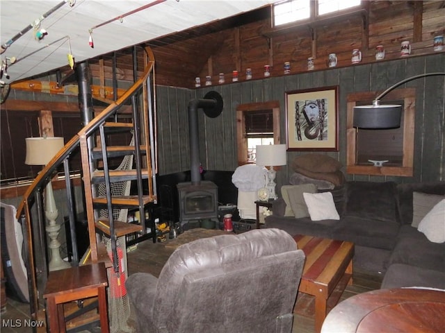 7301 Leafygreen St SW, Carrollton, OH 44615 - living area with a wood stove, wooden walls, and vaulted ceiling
