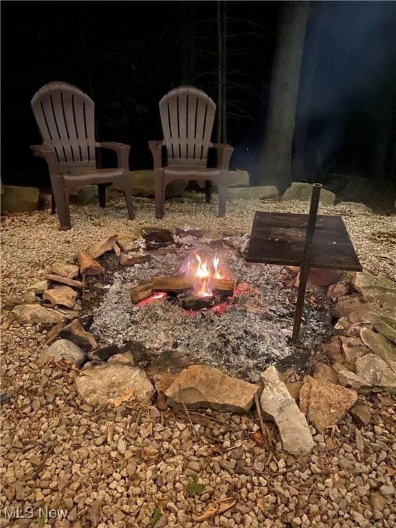 7301 Leafygreen St SW, Carrollton, OH 44615 - view of yard with an outdoor fire pit