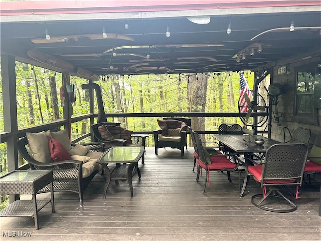 7301 Leafygreen St SW, Carrollton, OH 44615 - sunroom featuring outdoor lounge area, healthy amount of natural light, and outdoor dining area