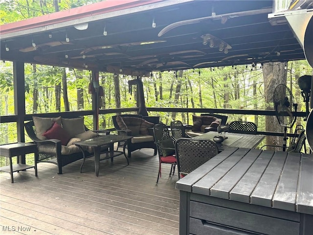 7301 Leafygreen St SW, Carrollton, OH 44615 - wooden deck featuring an outdoor living space