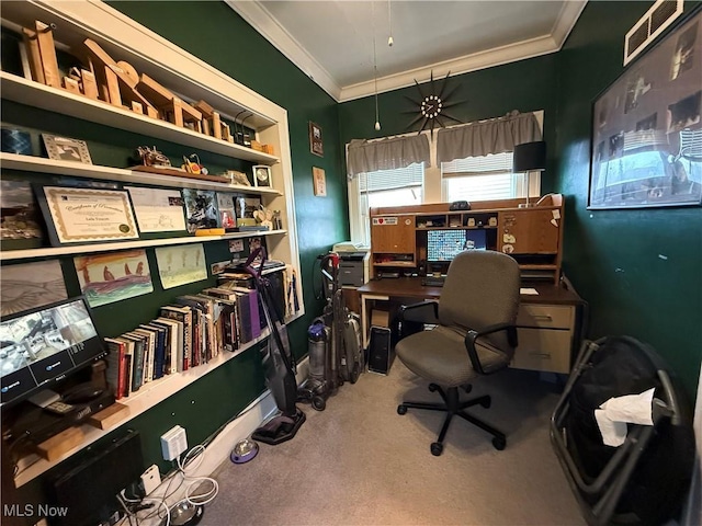 home office featuring carpet floors, visible vents, and crown molding