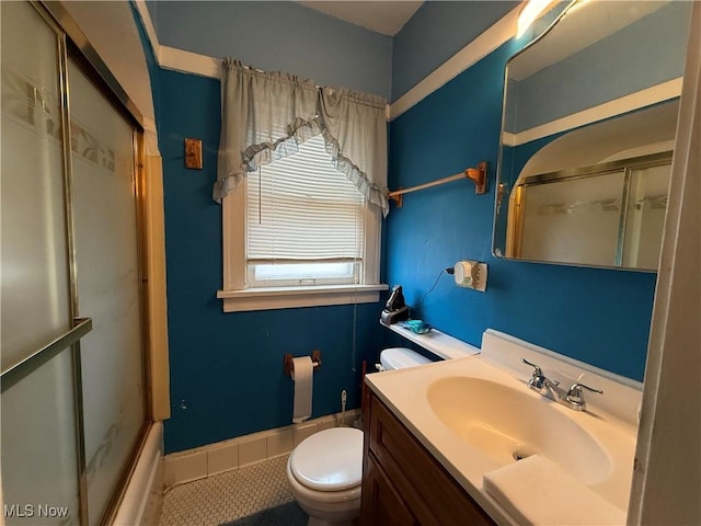 full bath featuring baseboards, toilet, tile patterned floors, and vanity