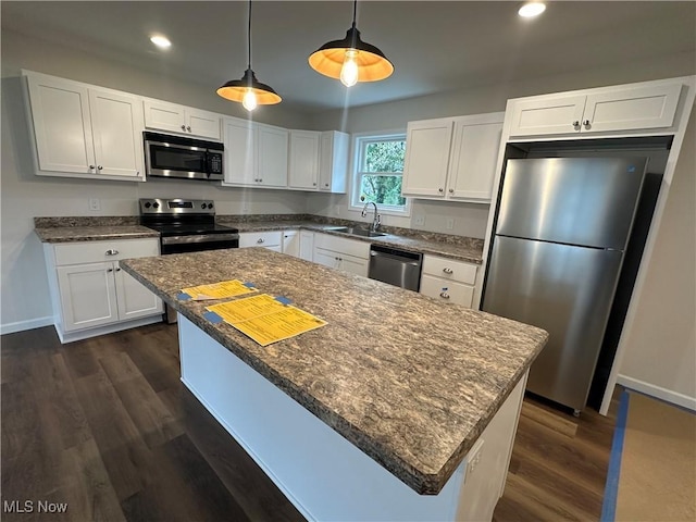 730 Mineral Springs Ave, Youngstown, OH 44511 - kitchen featuring stainless steel appliances, white cabinets, a sink, decorative light fixtures, and recessed lighting