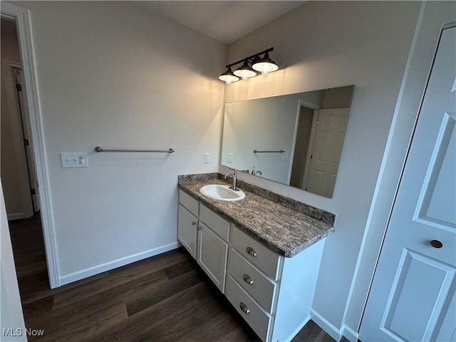 730 Mineral Springs Ave, Youngstown, OH 44511 - bathroom featuring wood finished floors, vanity, and baseboards