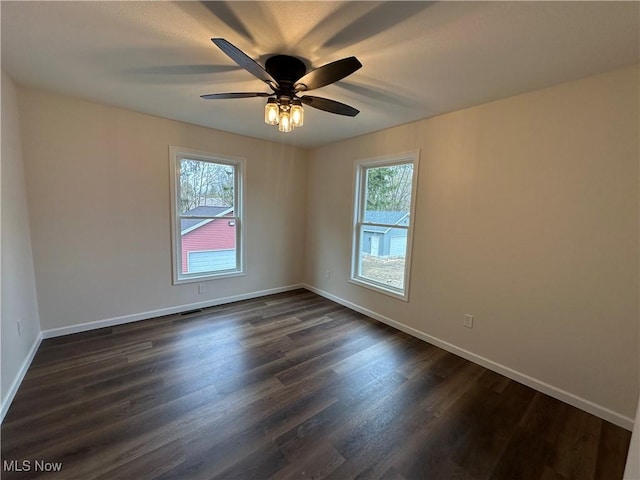 730 Mineral Springs Ave, Youngstown, OH 44511 - unfurnished room with healthy amount of natural light, dark wood-style flooring, and baseboards